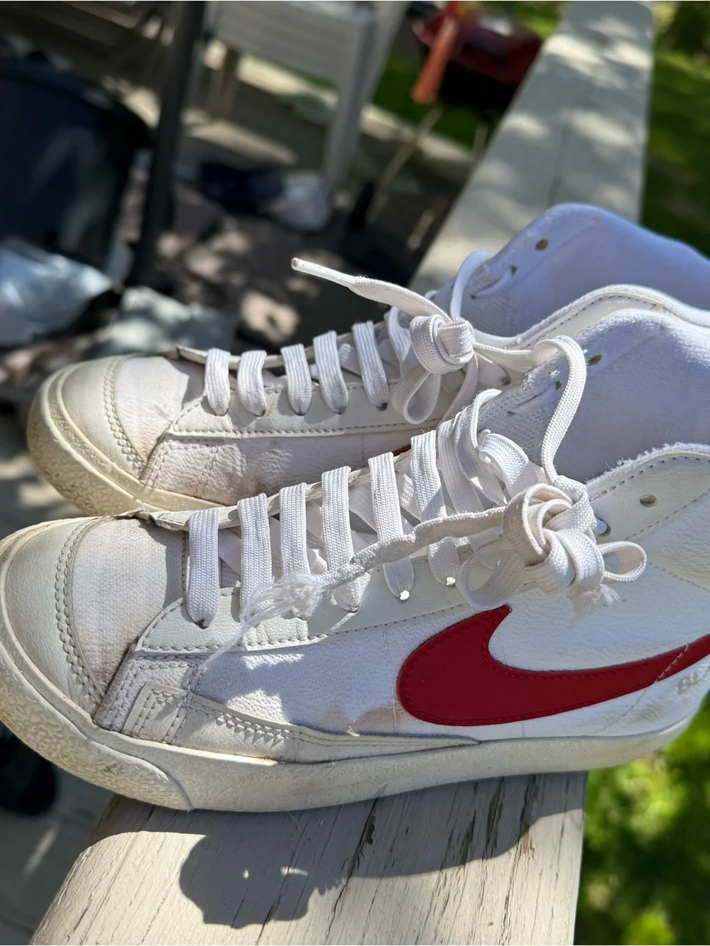 Nike White High-Top Sneakers with Red Swoosh Accent